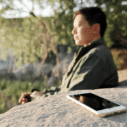 A person meditating without their phone nearby