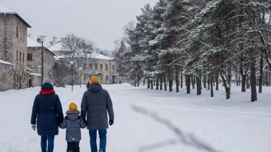 A serene winter landscape with a snowy urban - dailyglowandgrow Family of three walking through snowy winter landscape